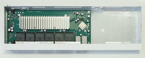 Internal view of a network switch showing circuit board and components.